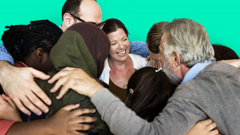 group hug everyone had help millionaire success business