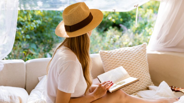 girl reading dreaming tropical