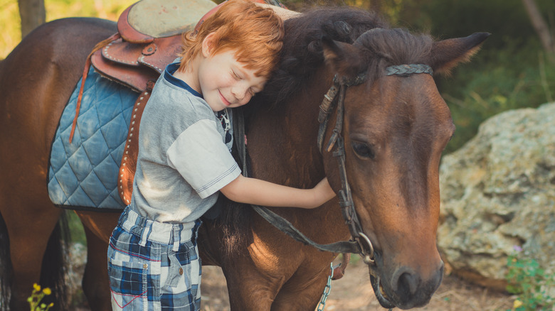 Redhead cowboy with horse