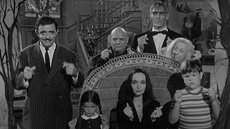 The Addams Family snapping their fingers