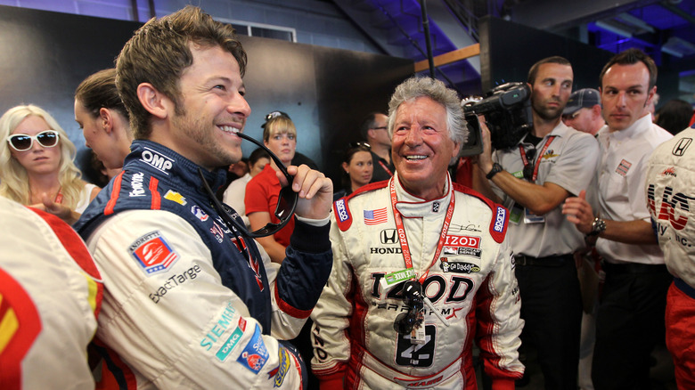 marco and mario andretti laughing