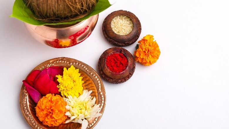 Puja of rice, spices, flowers