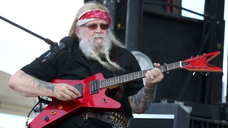 David Allan Coe playing guitar onstage