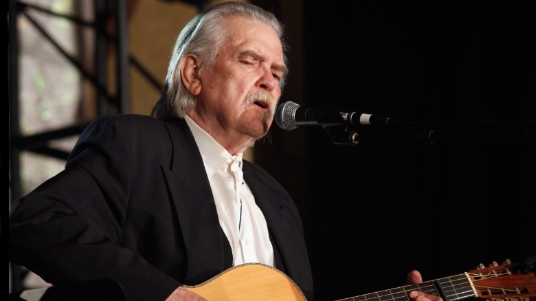 Guy Clark playing guitar and singing