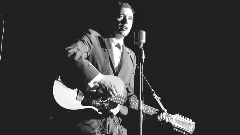 Bobby Bare, onstage playing guitar