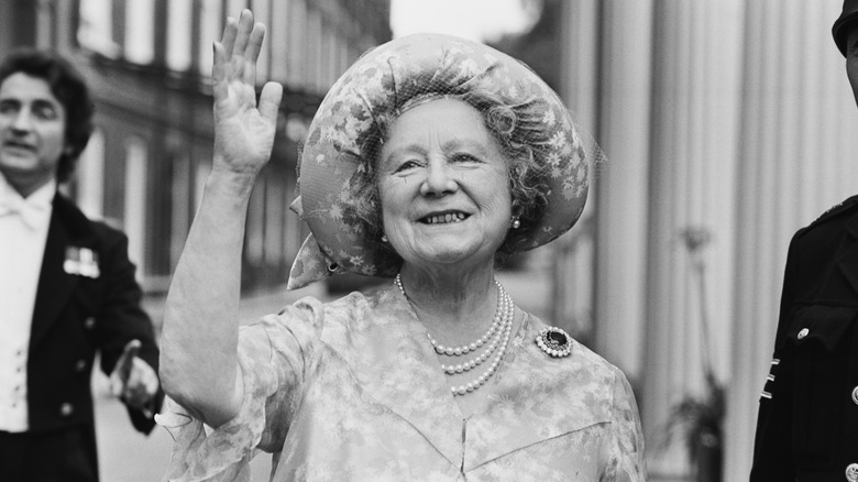 The Queen Mother smiling and waving