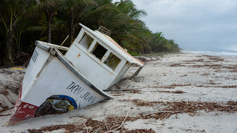 ship marooned on tropical beach