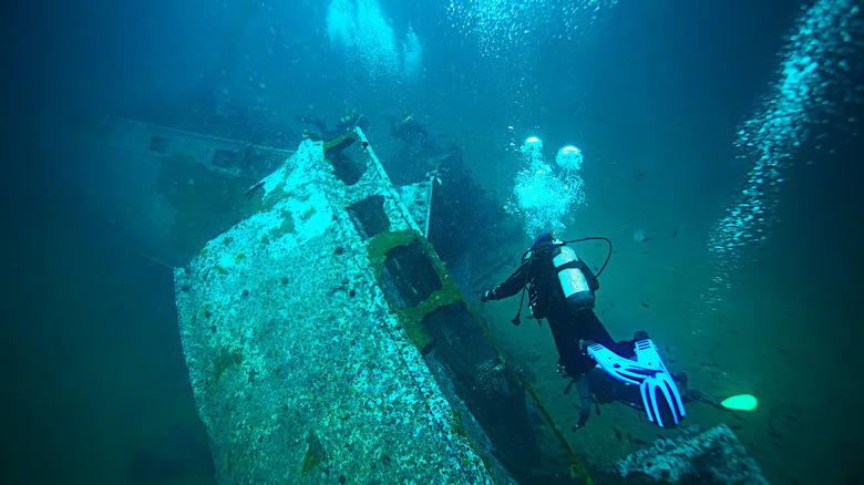 Scuba diver explores a shipwreck