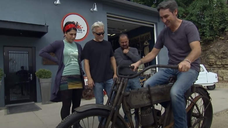 Mike Wolfe on a 1911 Harley Davidson motorcycle