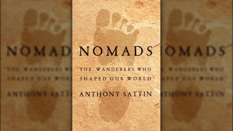 The cover of Nomads by Anthony Sattin with a human footprint in dust