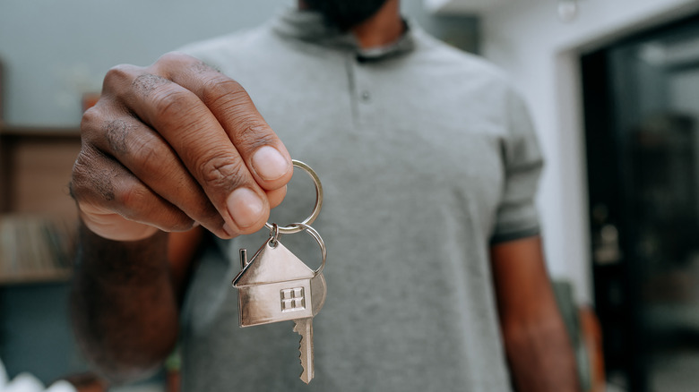 guy holding house keys