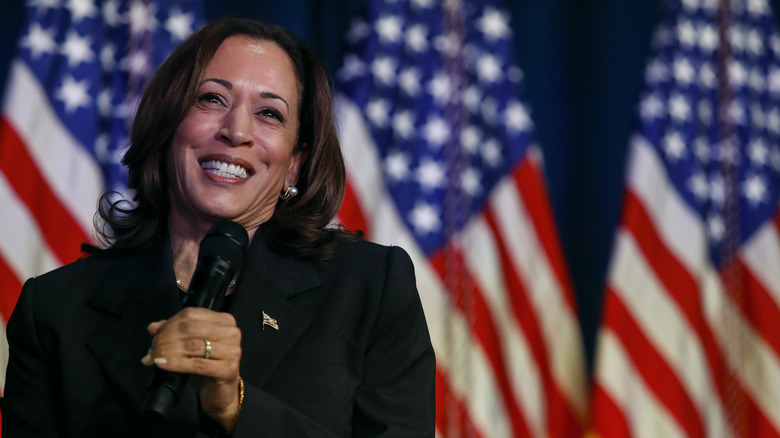 Kamala Harris smiling American flag 