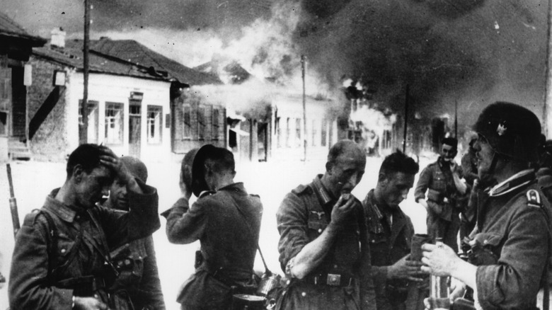 German troops stopped at burning town