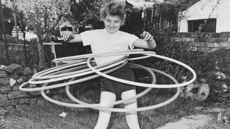 girl playing with hula hoops
