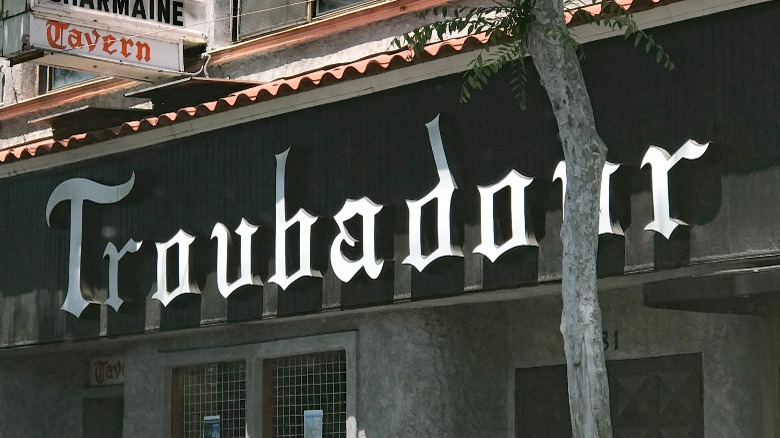 Troubadour front sign