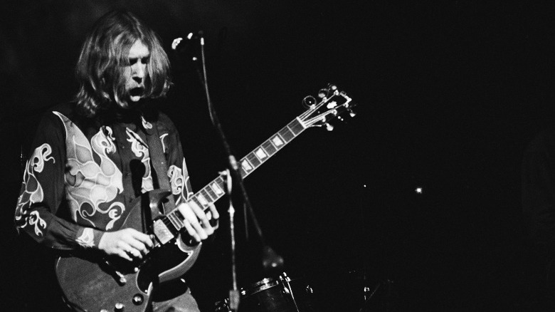 Duane Allman playing guitar onstage