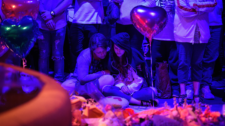 two women with balloon machester bombing vigil