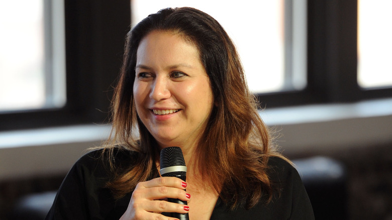 journalist Rukmini Callimachi holding microphone