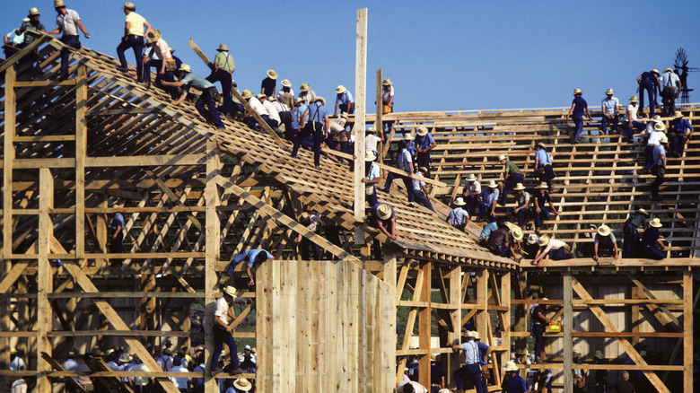 Amish men building a building