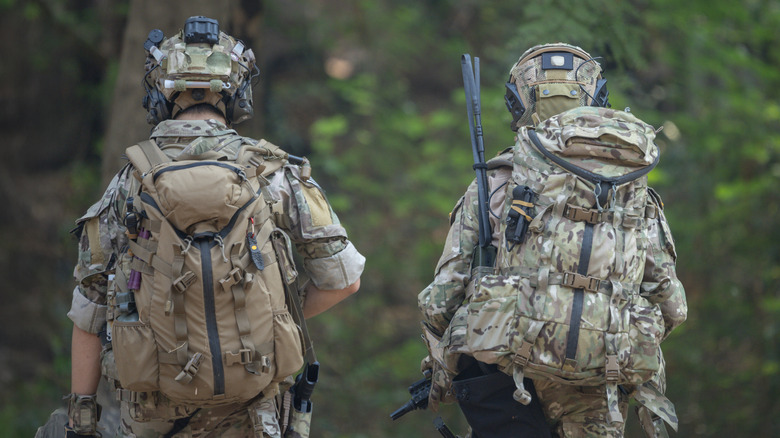 Soldiers wearing gear in forest