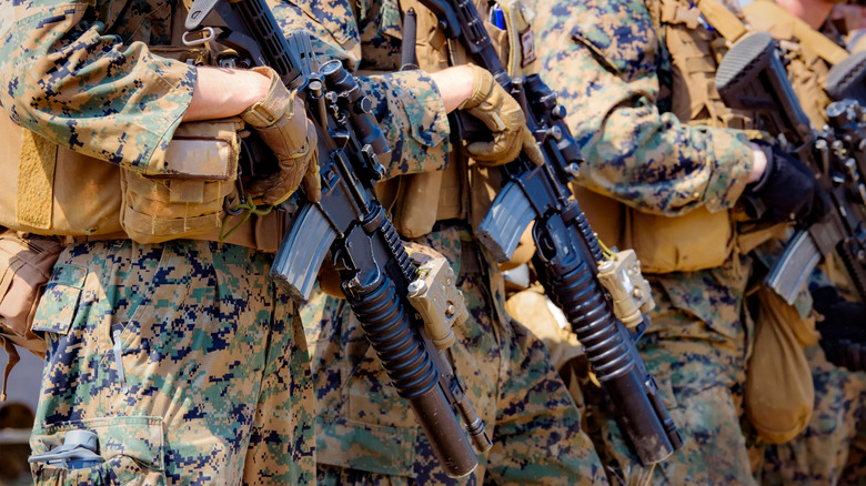 Soldiers carrying guns