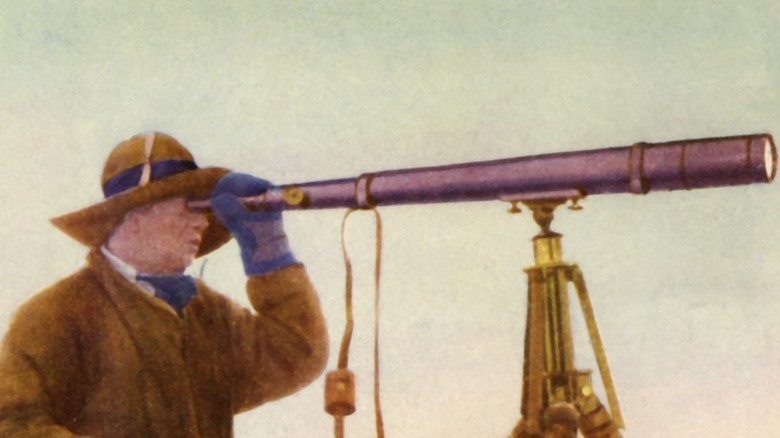 Robert Falcon Scott looks through telescope