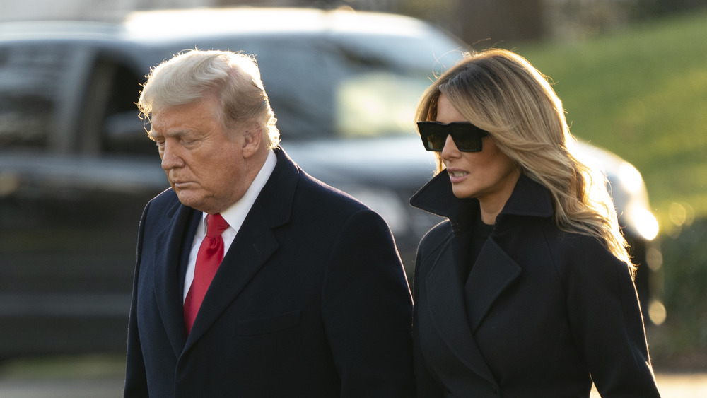 Donald and Melania Trump heads down walking