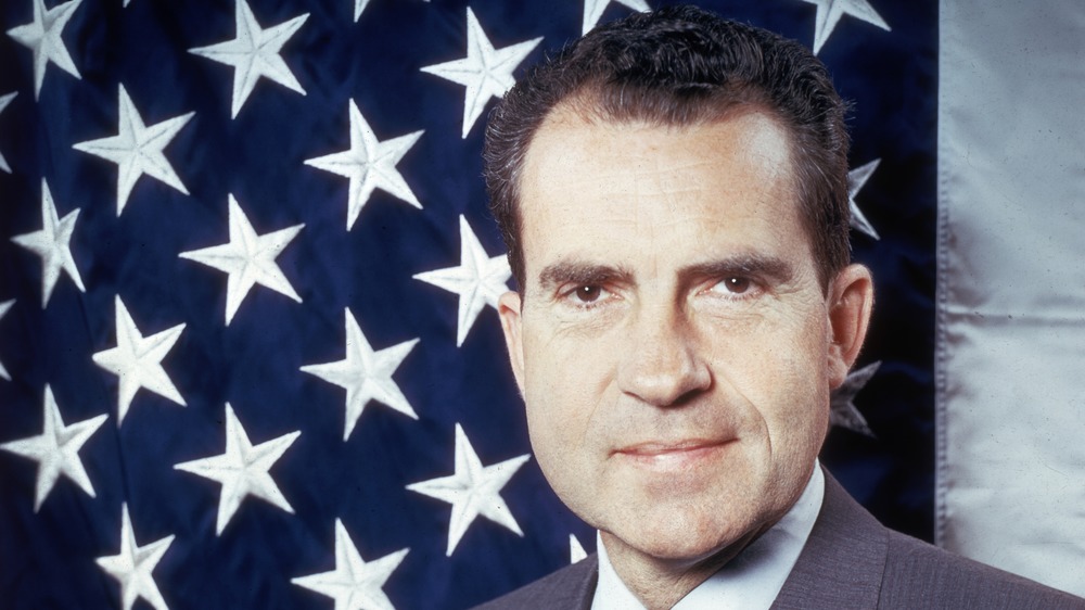 Richard Nixon in front of American flag