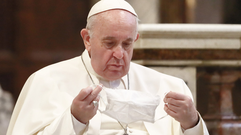 Pope Francis holding mask