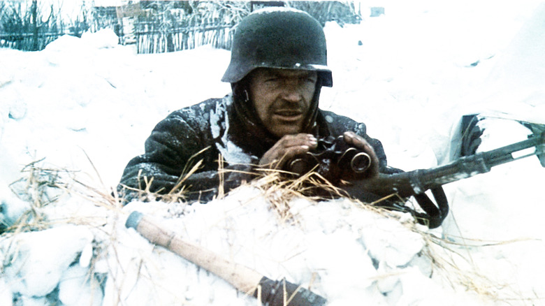 German soldier with binoculars rifle snow