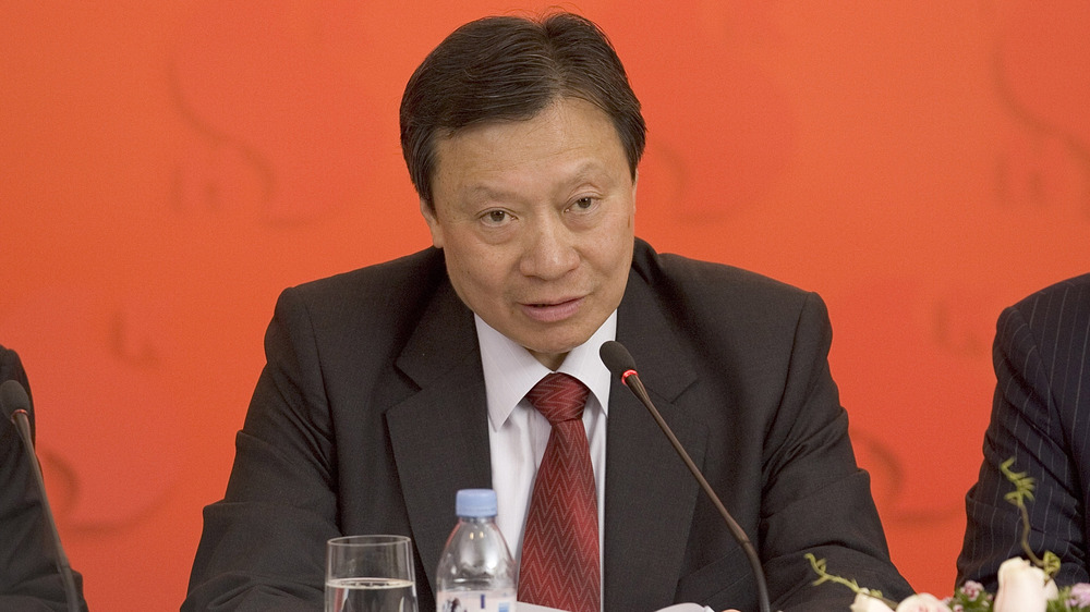 Walter Kwok speaking at a press conference