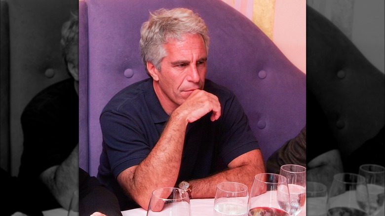 Jeffrey Epstein sitting in purple chair