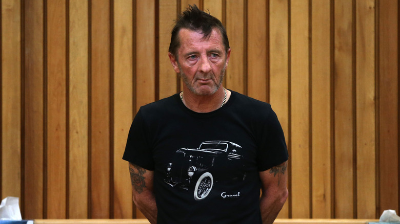 AC/DC's Phil Rudd standing in court in 2014