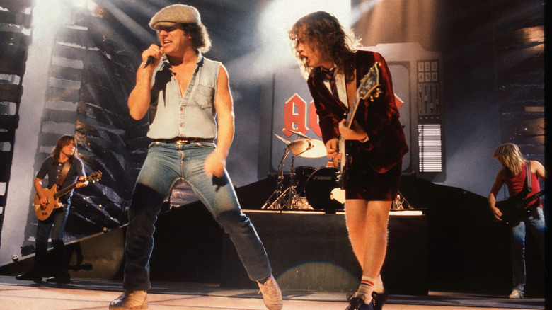 AC/DC's Brian Johnson and Angus Young performing on stage at the Brixton Academy in 1990