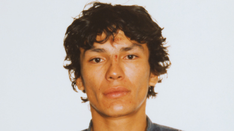 Richard Ramirez posing for his mugshot