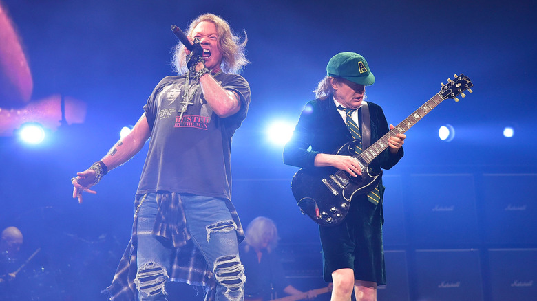 Axl Rose singing alongside AC/DC's Angus Young on stage in Philadelphia in 2016