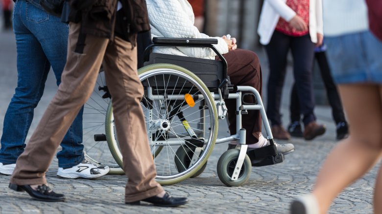 Wheelchair in a crowd