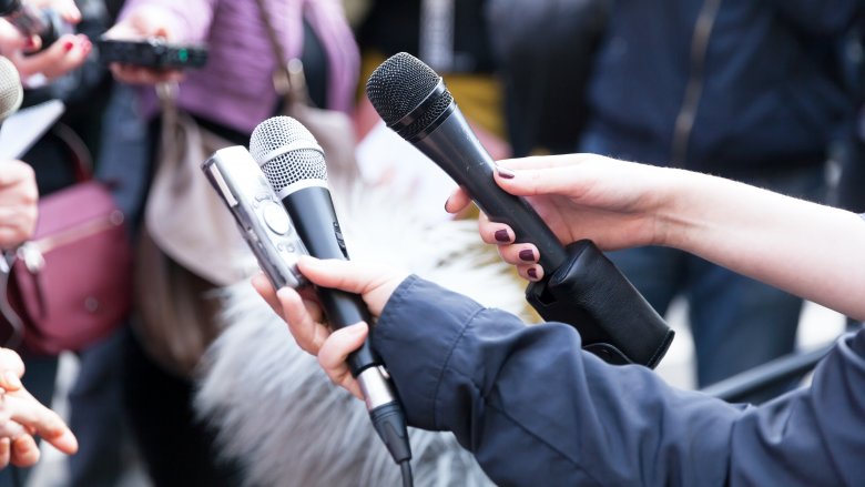 Reporters with microphones