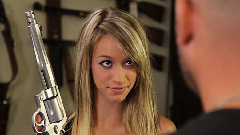 Paige Wyatt holding a large gun