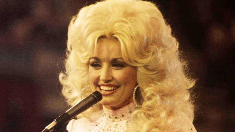 Dolly Parton smiling onstage 1976