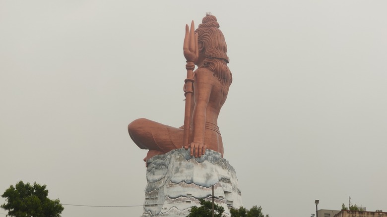 statue of belief from behind