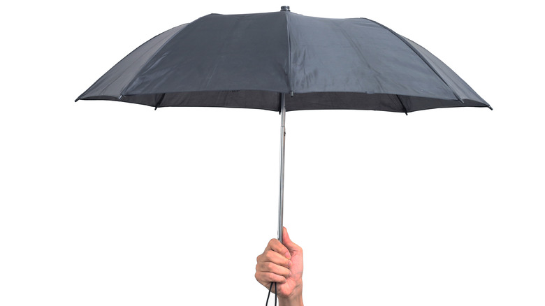 Man holding an umbrella