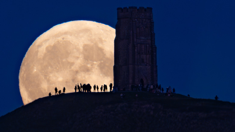 People gather at Glastonbury before a full moon