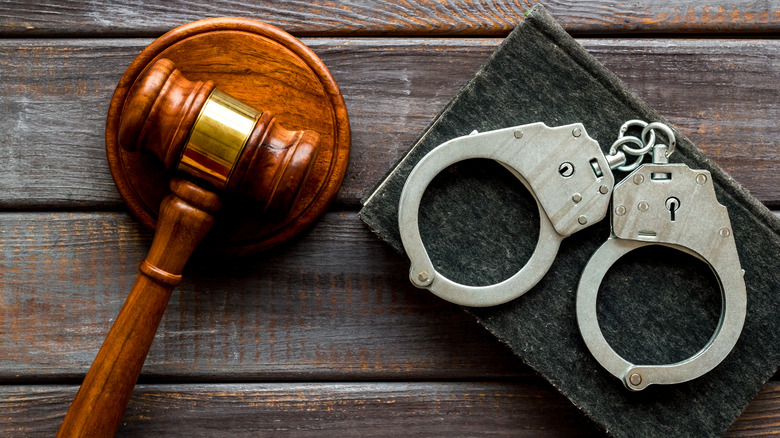 Handcuffs and wooden gavel 