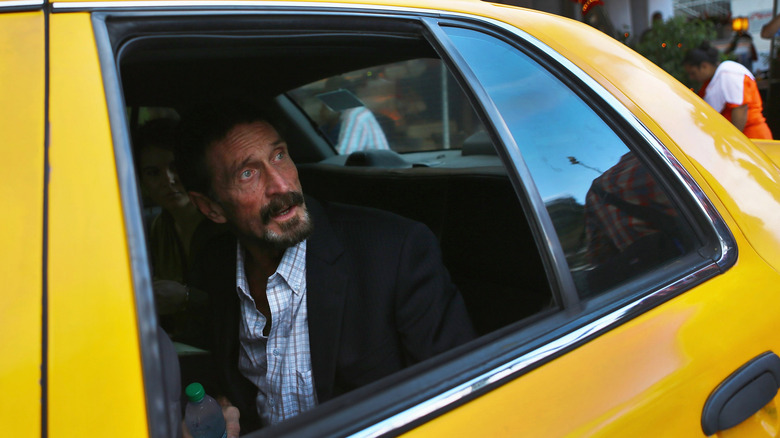 Entrepreneur John McAfee in a taxi