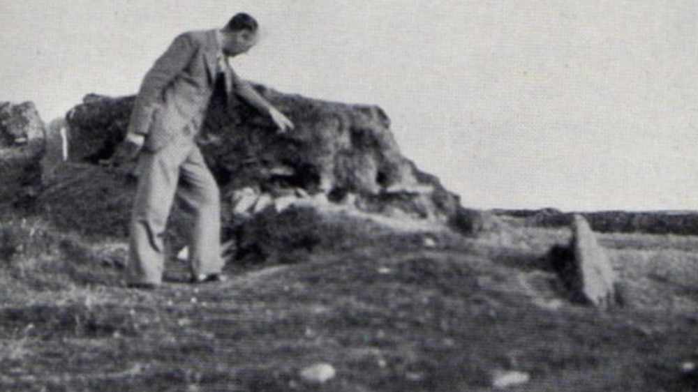 Investigator Richard Lambert points to mound where Gef killed rabbits