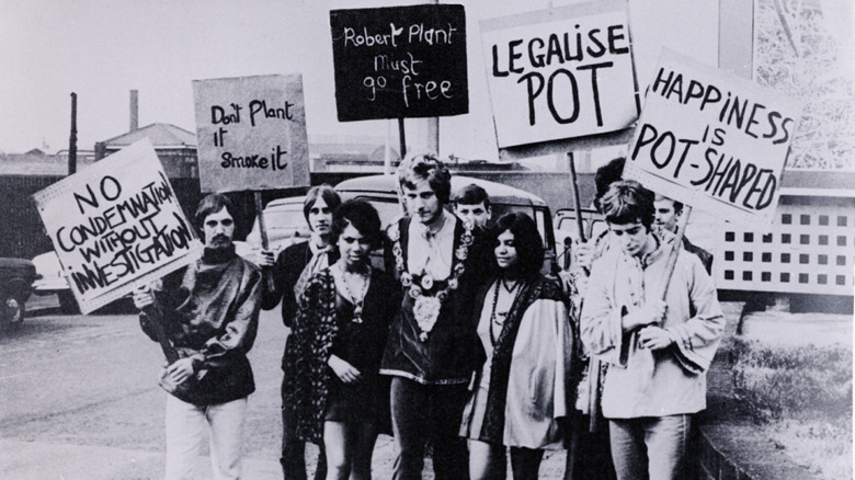 A teenage Robert Plant and his friends holding pro-pot signs in 1967 as he heads to court