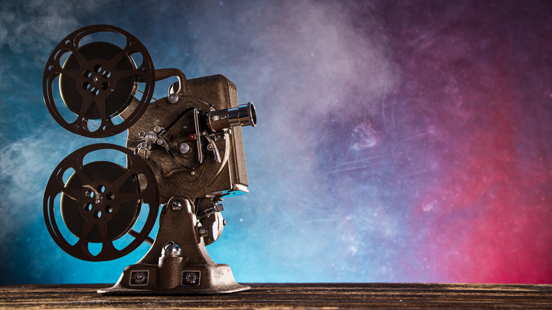 Old film projector on smokey background