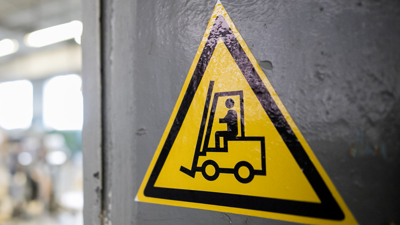 forklift yellow triangle warning sign