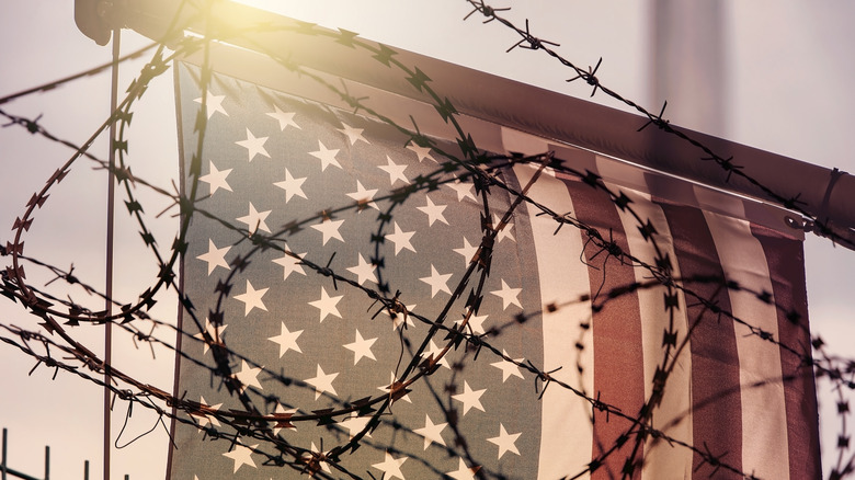 U.S. flag and barbed wire 